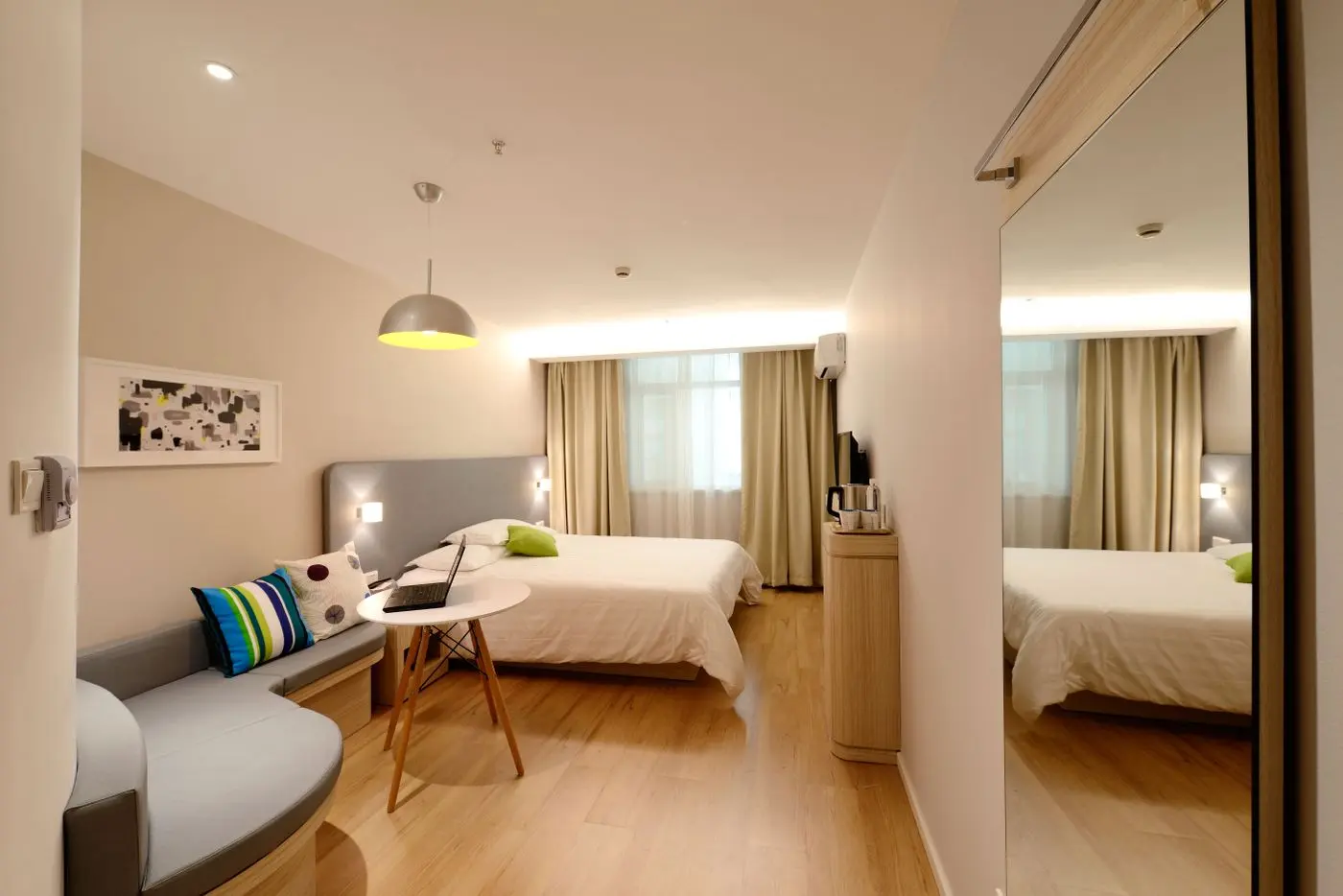 Clean comfortable bedroom representing reliable home cooling