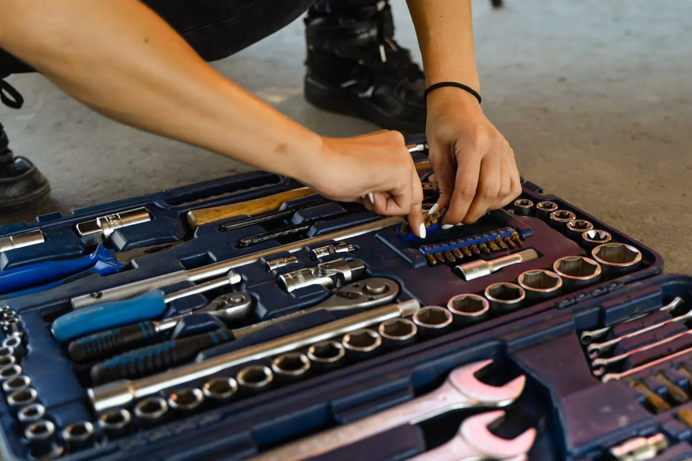 Experienced technician inspecting equipment during a professional service visit
